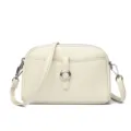Stylish off-white leather crossbody bag with unique woven metal ring clasp and strap. - Off White