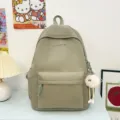 Minimalist solid color canvas backpack, large capacity school bookbag for casual daily use. - Green