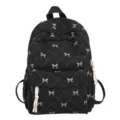 Zaino trapuntato nero con ricamo di fiocco, borsa scolastica casual ed elegante per donne e ragazze. - Nero
