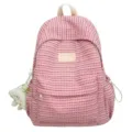 Zaino rosa con texture waffle e ciondolo in peluche, borsa casual per studenti e scuola. - Rosso