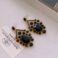 Close-up of vintage gold-tone geometric rhinestone earrings with black teardrop crystal. - Silver Post Earrings (4#) / Gold-Black