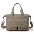 Detail view of large capacity nylon tote bag, casual commuting crossbody bag with front pockets. - Cocoa