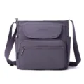 Greyish purple nylon crossbody bag detail, multi-pocket design with adjustable strap. - Taro Ball Grape