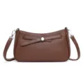 Classic brown leather crossbody bag with chic metal accent, versatile casual shoulder purse for women. - Coffee