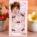 Detail view of 3D crystal rhinestone butterfly and bow nail art body gem stickers. - Pink