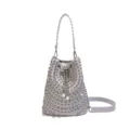 Light gray leather bucket bag with metallic studs, rhinestones, and drawstring pearl details. - Gray