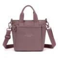 Purple nylon crossbody bag with dual top handles, detachable shoulder strap, and front pocket. - Tree Pink
