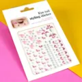 Vue détaillée d'autocollants strass roses pour le coin de l'œil avec formes de lune. - Rose Queue de Poisson