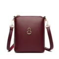 Burgundy leather phone crossbody bag with metal gourd charm, chic small shoulder bag variant. - Burgundy