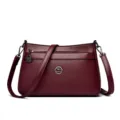 Wine red leather shoulder bag for women, multi-compartment crossbody with metal accents. - Burgundy