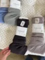 Detailed view of cozy knitted slouch socks in multiple colors, perfect for autumn and winter. - One Size / Dark Coffee