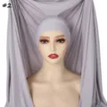 Detail view of the grey integrated hijab and long scarf cap, featuring soft knit fabric. - Gray (#2)