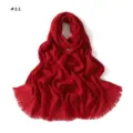 Detailed view of the solid red crinkled scarf with stylish fringe tassel edges. - Red