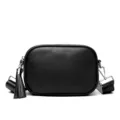 Classic black leather crossbody bag for women, stylish camera shoulder bag with tassel. - Black
