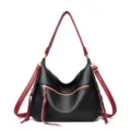 Black and red leather hobo shoulder bag with crossbody strap and tassel zipper pocket. - Black and Red