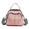Zaino multifunzionale rosa da donna con rivetti in strass e pratica borsa a mano chic. - Rosa