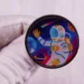 Space astronaut spaceship metal badge pin accessory, detailed close-up shot of round brooch. - Astronaut Spaceship Round Printed Style (2E-40-4-3/C12-02-D01)