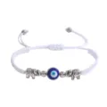 Bracelet réglable en corde tressée blanche avec mauvais œil bleu et charmants pendentifs éléphants. - Éléphant Argent (Corde Blanche)