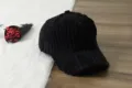 Detailed view of a black corduroy baseball cap, featuring classic design for autumn and winter wear. - Adjustable / Black