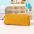 Corduroy pencil case detail view, soft yellow stationery pouch for school and office use. - Chocolate