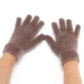 Close-up detail of fuzzy brown knit five-finger winter gloves showing soft fluffy texture. - Tan