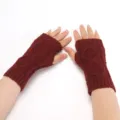 Close-up detail of winter knitted fingerless gloves in burgundy with classic diamond pattern. - Burgundy