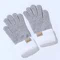 Detail view of winter grey knit gloves featuring soft white plush cuffs and cozy warmth. - One Size / Gray