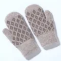 Close up of fluffy knitted winter mittens texture, warm diamond pattern detail view indoors - One Size / Camel