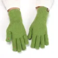 Close-up detail shot of green knitted fingerless gloves, showing the texture and thumb hole design. - Extended 27x10cm / Grass Green