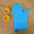 Blue silicone oven mitt with anti-slip texture and hanging loop for safe baking use. - Single Piece / Sapphire Blue