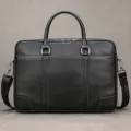 Black cowhide leather business briefcase detail showing fine texture, metal hardware and handles. - Black (3824)
