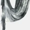 Detailed close-up of the grey and white tie-dye textured fabric drape with soft fringe. - Gray