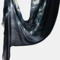 Detail view of lightweight tie-dye wrinkled scarf with gradient blue pattern and fringe. - Dark Navy
