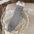 Women's grey mid-calf stack socks with cute white lace ruffle trim, soft breathable cotton. - Light Gray