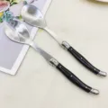 Stainless steel salad serving spoon and fork set with black handle for kitchen dining. - Salad Fork and Spoon Sets