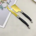 Set de cuchillos para queso de acero inoxidable con hoja dorada y mango negro para mantequilla. - Juego de Cuchillos para Queso / Negro