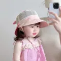 Pink baby sun hat detail showing breathable mesh crown, cute brim embroidery and chin strap. - Pink