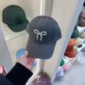 Dark grey baseball cap featuring a delicate pearl bow design, stylish and cute sun hat. - Adjustable / Dark Gray Pearl Bow Baseball Cap