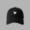 Black cotton baseball cap featuring a chic white and blue embroidered heart design for daily wear. - Black