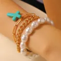 Conjunto de pulseras multicapa bohemias con colgante de cruz turquesa y perlas. - Estilo Cruz Dorada (8039) / Dorado