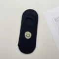 Calcetín invisible negro con cara sonriente, diseño de malla transpirable, cómodo uso casual. - Talla única / Negro