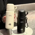 Detail shot of dual-drink stainless steel vacuum flask with portable handle in black and white. - Support Customization (Contact Customer Service)