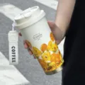 Tragbarer Edelstahl-Kaffeebecher mit Sonnenblumen-Kunstdruck für Büro und Reise mit Handschlaufe. - Sonnenblume - Doppeltrinkdeckel