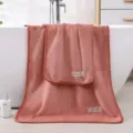 Dicke Korallenfleece Handtuch und Badetuch Set mit farblich passendem Rand für Zuhause. - Orange