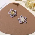 Accesorios DIY de flores huecas de cuentas hechas a mano para pendientes y anillos bonitos. - Púrpura