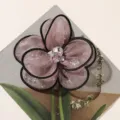 Exquisite mesh fabric flower detail, featuring black trim and sparkling crystal rhinestone center. - Lotus root pink
