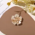 Detailed view of pearl flower patch with crystal bead center for DIY jewelry accessories. - Irregular Five-Petal Style (Champagne Core)