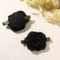 Close-up detail of black organza rose hair clip showing delicate petals and green ribbon. - 1 Piece/Pack / Black