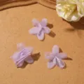Close-up detail of light purple sheer organza five-petal flower DIY craft accessory material. - Purple