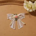 Detailed shot of 3d lace bow flower patch, white mesh ribbon and handmade fabric rose appliques. - Bow Style 2
